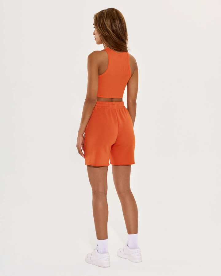 Cropped top with sporty cut and open shoulders